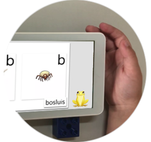 Close-up of tablet screen with letter activity
